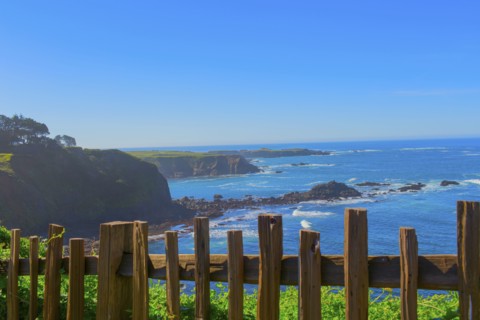 Wood fence overlooking rocky coastline