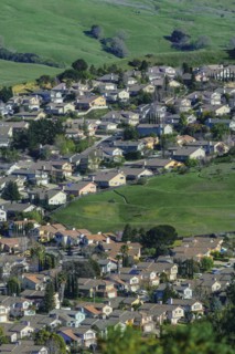 Aerial view of suburban neighborhood in rolling landscape