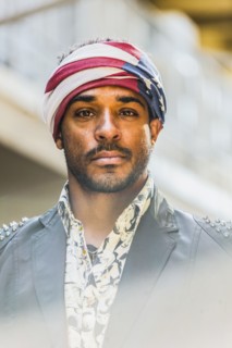 Mixed race man wearing American flag turban