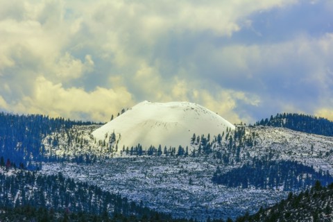 Snowy mountains under clouds