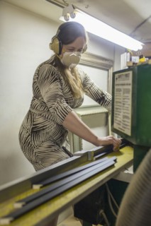 Caucasian artist working in workshop