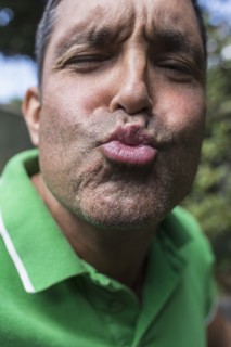Mixed race man puckering