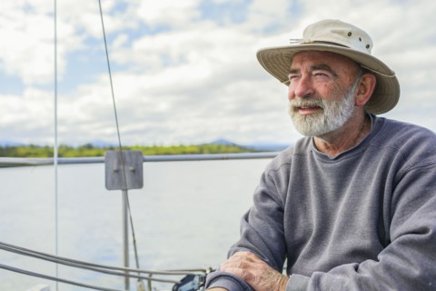Caucasian man sailing on boat