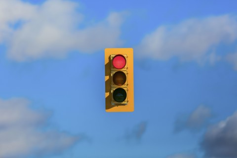 Stoplight floating in sky