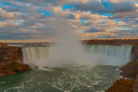 Niagara Falls mist under cloudy sky
