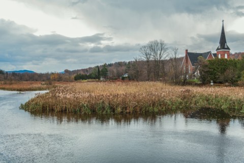 River and church in rural landscape