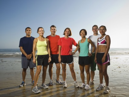 Multi-ethnic runners at beach