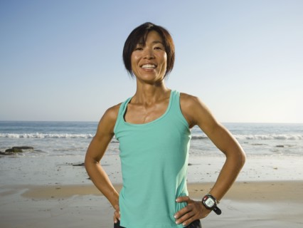Asian woman with hands on hips