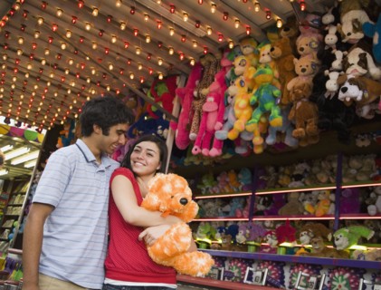 Multi-ethnic teenaged couple at carnival