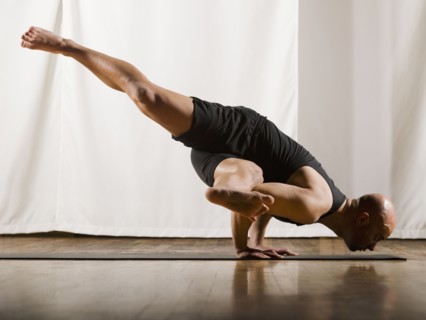 Hispanic man practicing yoga