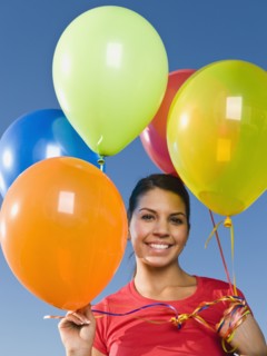 Native American holding balloons