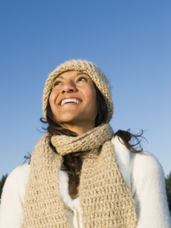 Mixed race woman looking up and smiling