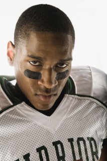 African football player with face paint under eyes