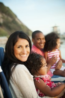 Family sitting together on beach