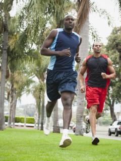 Men running in park together