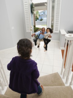 Daughters greeting returning father