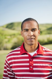 Serious Black man standing outdoors