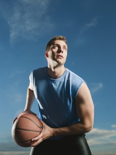 Caucasian man playing basketball
