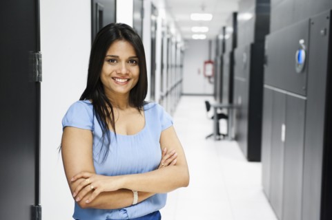 Indian businesswoman standing in server room
