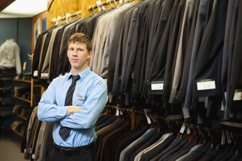 Caucasian man working in men's clothing store
