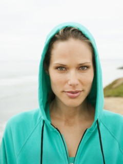 Serious Caucasian woman wearing hooded jacket