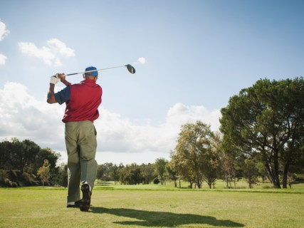 Black man playing golf