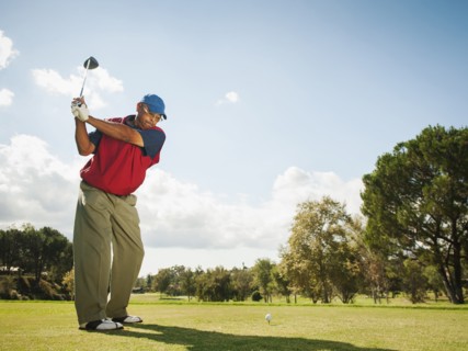 Black man playing golf