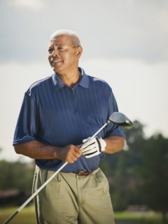Black man playing golf