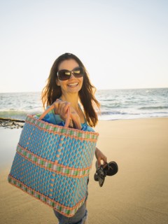 Mixed race woman walking on beach