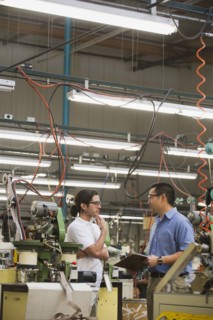 Workers talking in textile factory