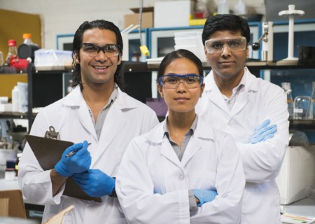 Scientists smiling in laboratory
