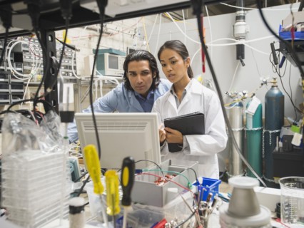 Scientists working in laboratory