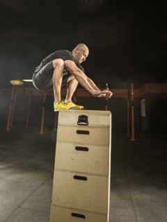 Caucasian man exercising in gym