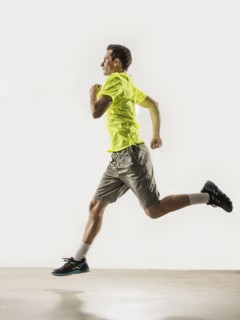 Caucasian man jogging indoors