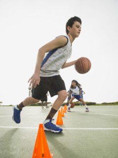 Basketball team doing drills at practice