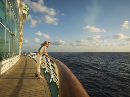 Caucasian couple admiring view from boat deck