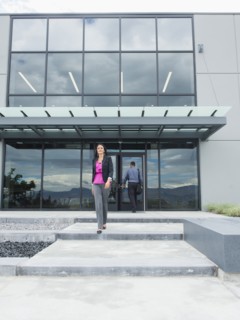 Businesswoman walking outside office building
