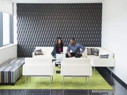Business people talking in office lobby