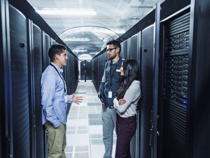 Technicians talking in server room