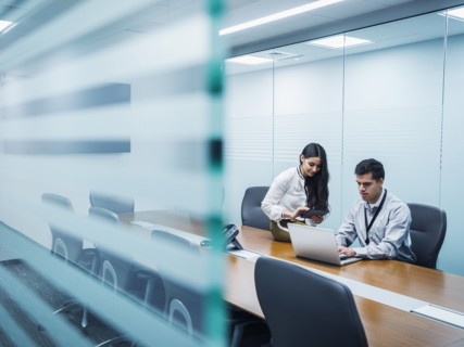 Business people using technology in conference room