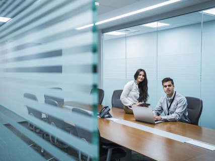Business people smiling in conference room