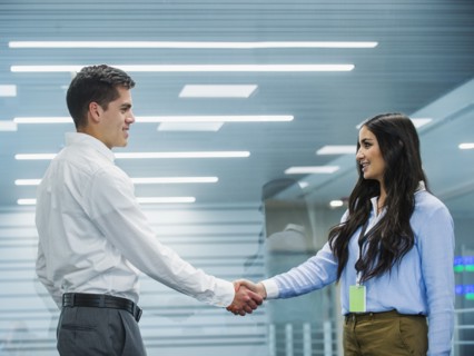 Business people shaking hands in office