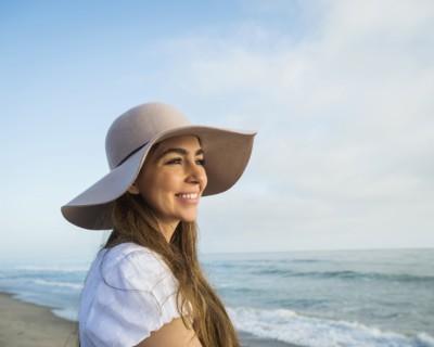 Caucasian woman smiling on beach