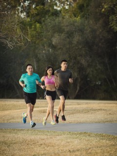 Chinese friends jogging in park
