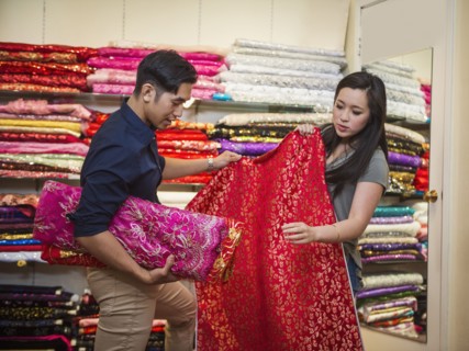 Chinese man and woman shopping for fabric