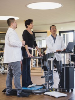 Physical therapists examining patient
