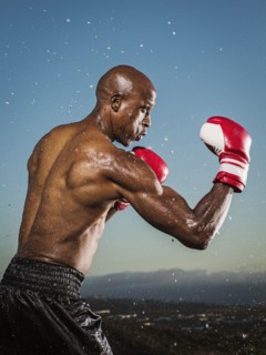 Water splashing on black boxer outdoors