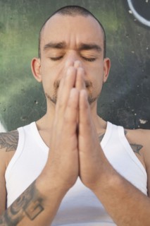 Hispanic man praying