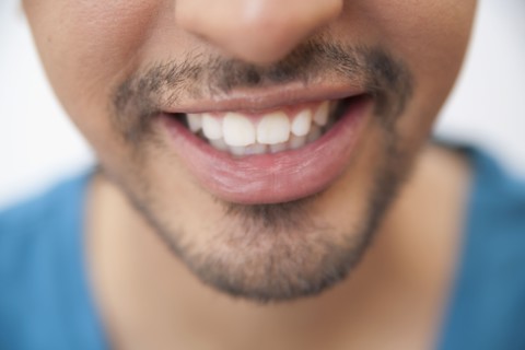 Close up of Hispanic man's mouth and goatee