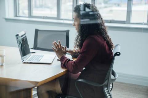 Mixed race businesswoman on video conference